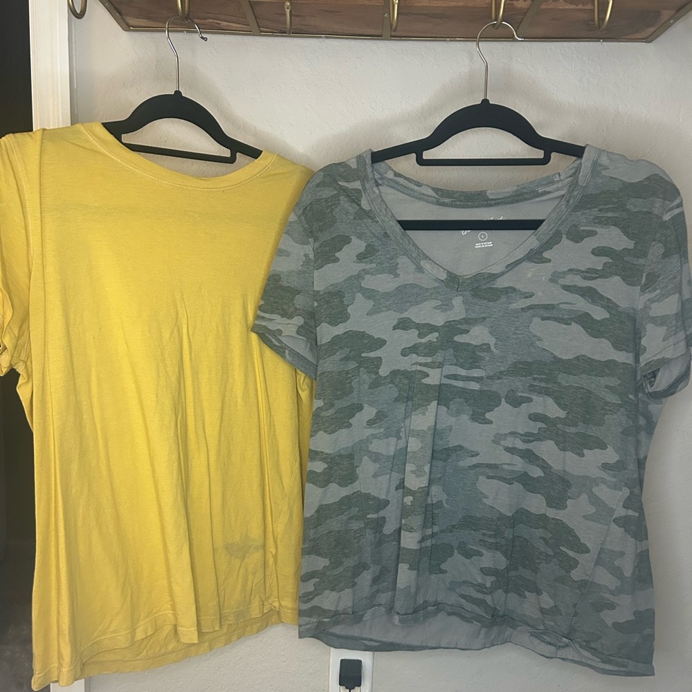 To loose fitting shirts, one yellow in one camo